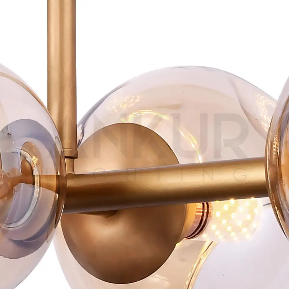 ANKUR JONAS 8 LIGHT CHAMPAGNE GLASS WITH GOLDEN LINEAR CHANDELIER - Ankur Lighting