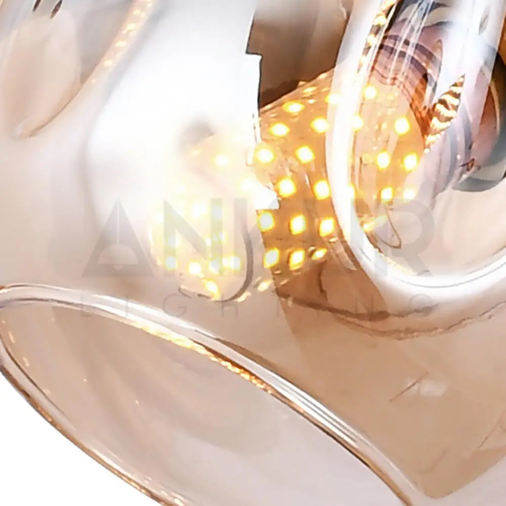 ANKUR JONAS 8 LIGHT CHAMPAGNE GLASS WITH GOLDEN LINEAR CHANDELIER - Ankur Lighting