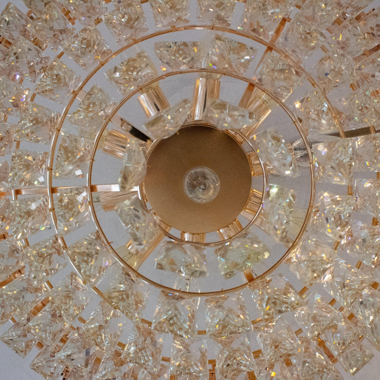 ANKUR ROUND CRYSTAL CHANDELIER WITH GOLD METAL PLATE - Ankur Lighting